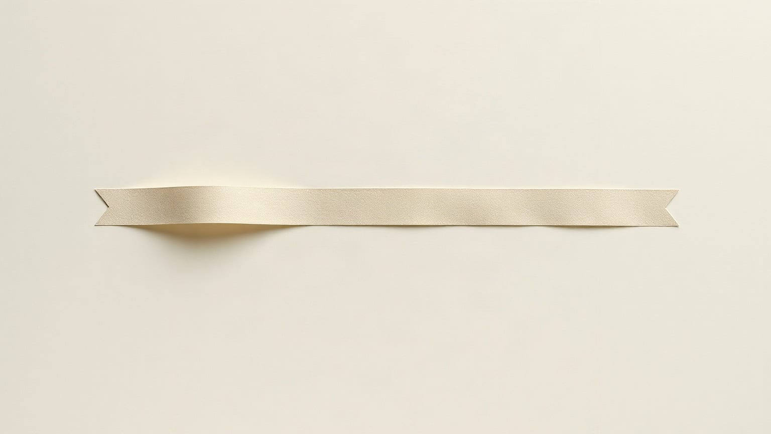 A single long narrow ribbon of undyed linen-coloured paper stretching across an empty cream ground